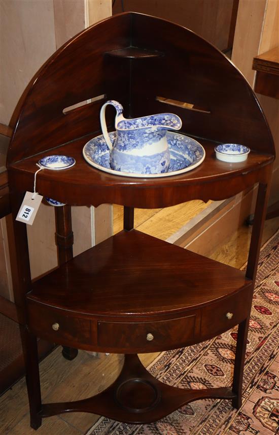 A George III mahogany corner washstand, with blue and white ceramics H.102cm